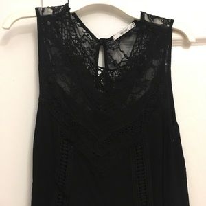 Lacy black tank with eyelet cutout design